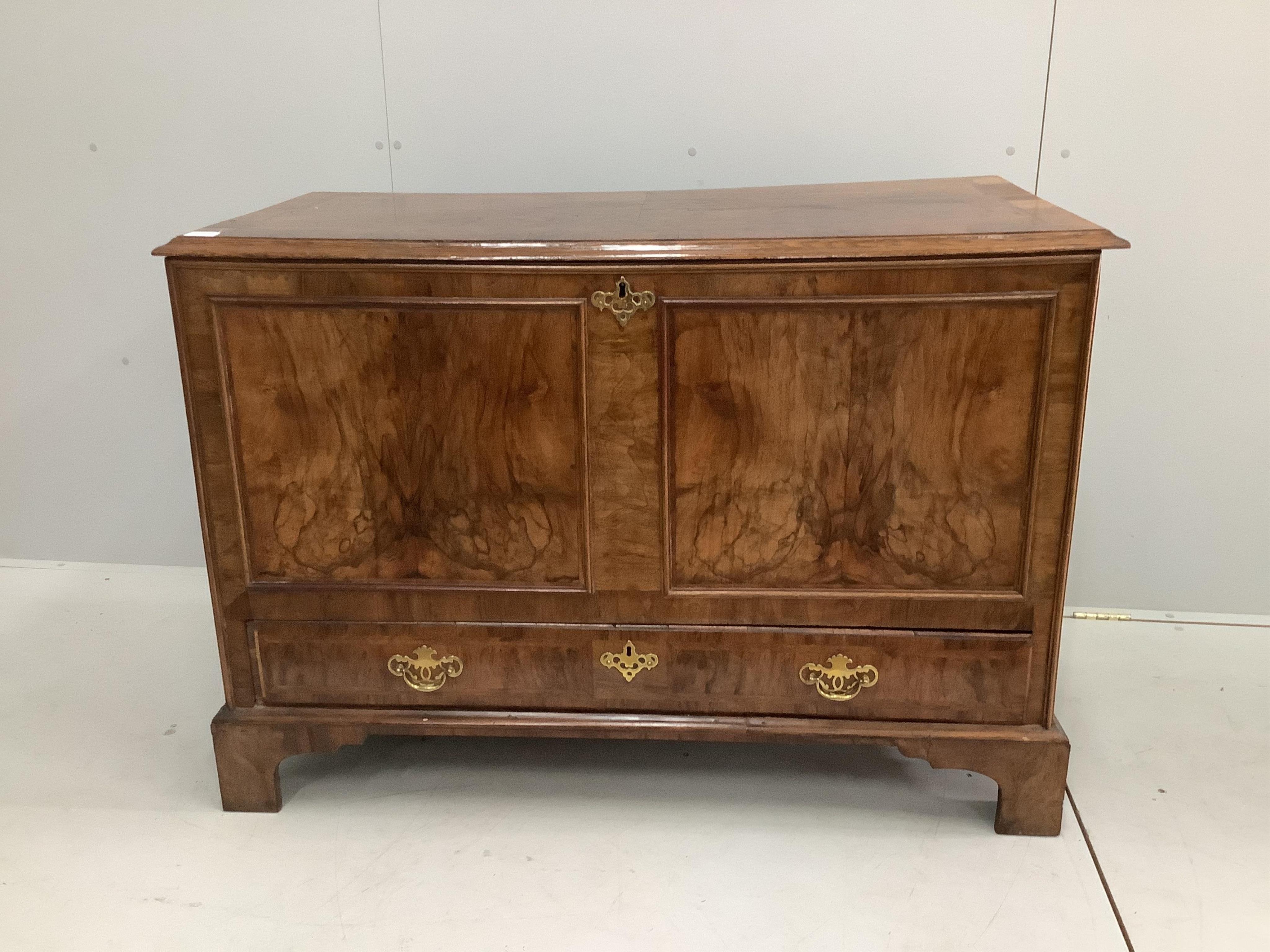 A George I / II feather-banded walnut and oak mule chest, width 120cm, depth 57cm, height 84cm. Condition - fair